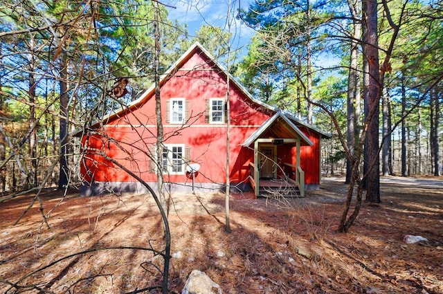 back of property with an outdoor structure