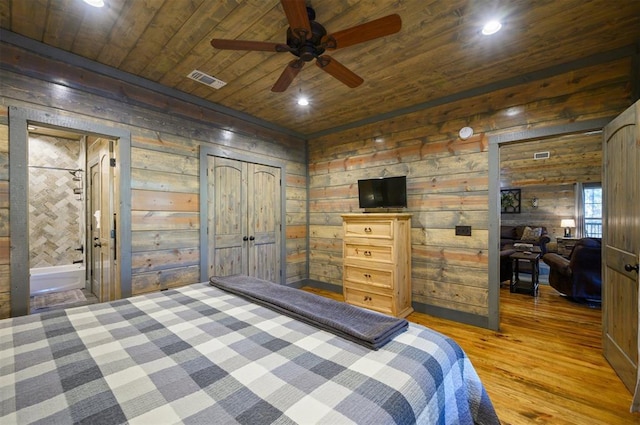 bedroom featuring wood ceiling, wood-type flooring, and wood walls