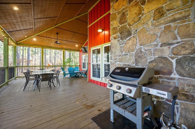 wooden deck featuring a grill and ceiling fan