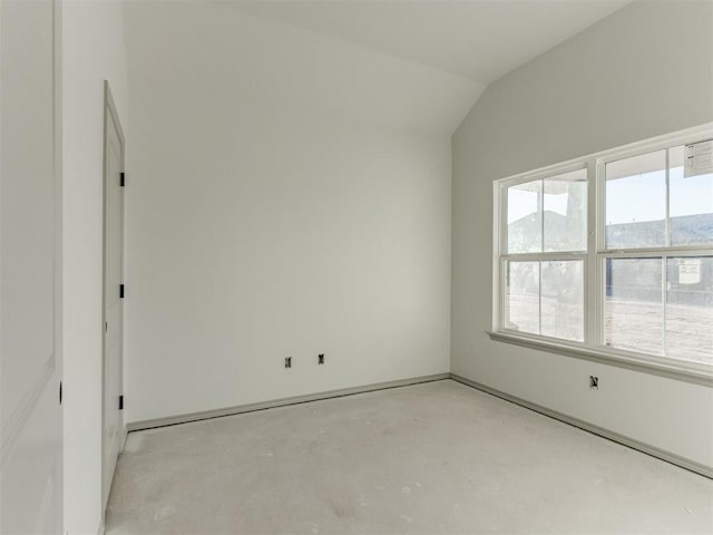 empty room with lofted ceiling