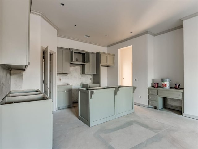 kitchen with crown molding, a kitchen breakfast bar, a kitchen island, and gray cabinetry