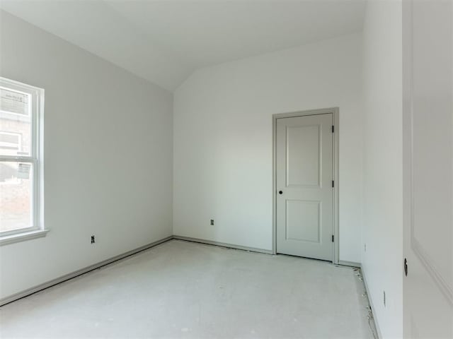 empty room with vaulted ceiling