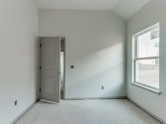 empty room with vaulted ceiling