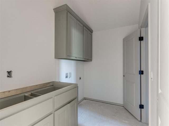 washroom featuring cabinets, hookup for a washing machine, and electric dryer hookup