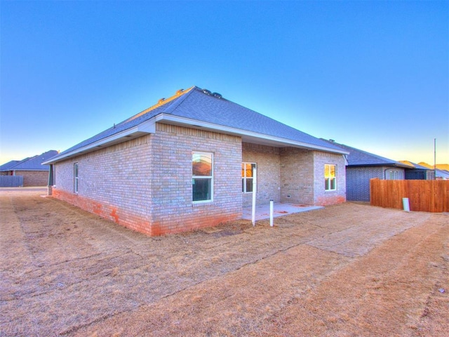 view of property exterior at dusk