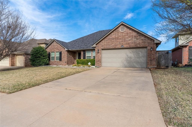 view of front of home featuring a front lawn and a garage