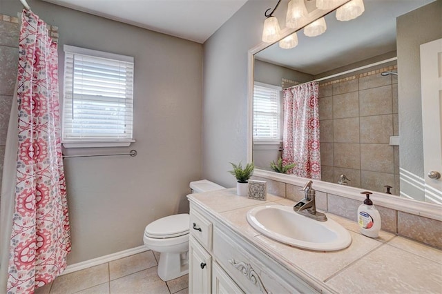 bathroom featuring toilet, vanity, and tile patterned floors