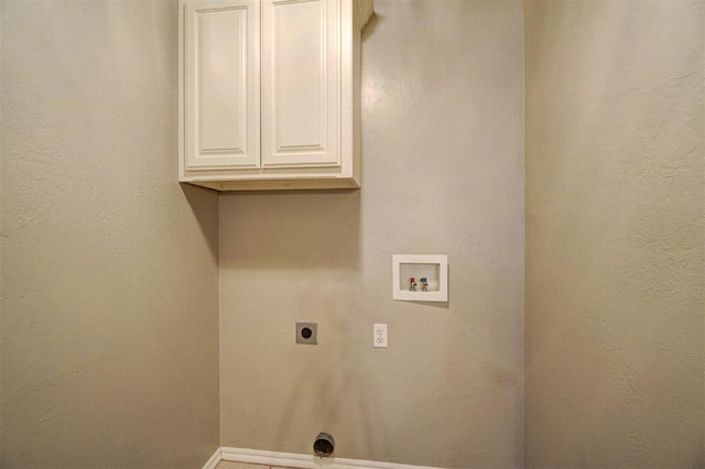 washroom with washer hookup, cabinets, and hookup for an electric dryer