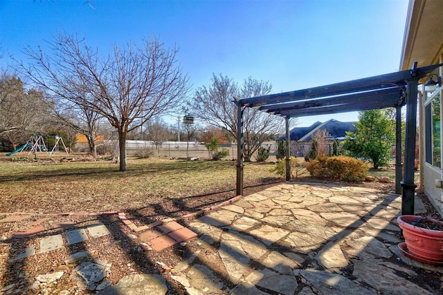 view of patio / terrace with a playground and a mountain view