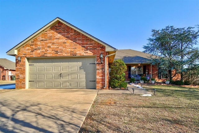 view of front property with a front yard and a garage