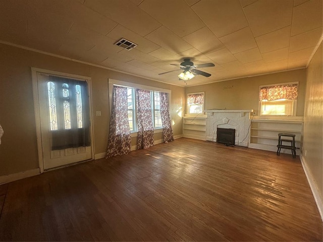 unfurnished living room with ornamental molding, ceiling fan, and hardwood / wood-style floors