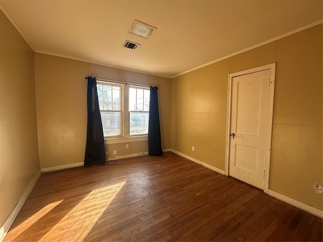 spare room with hardwood / wood-style floors and ornamental molding