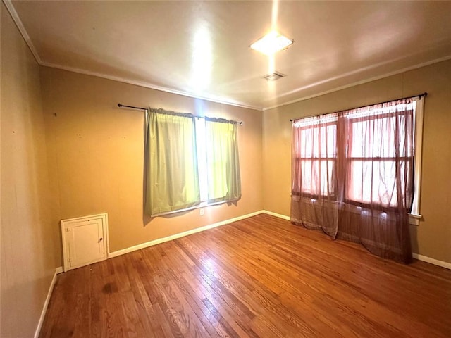 spare room featuring hardwood / wood-style flooring