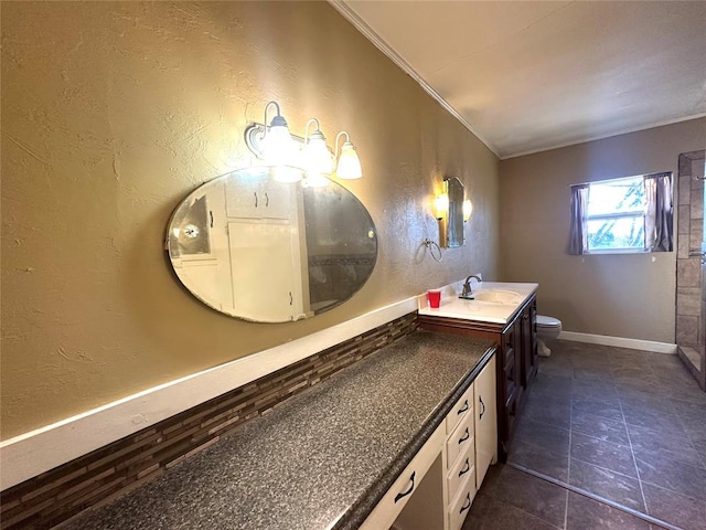 bathroom featuring ornamental molding, tile patterned flooring, vanity, and toilet