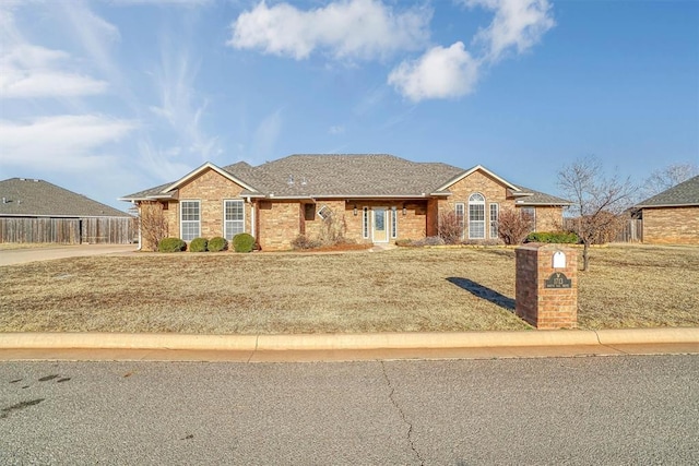 ranch-style home with a front yard