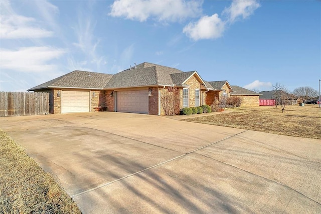 ranch-style home featuring a garage