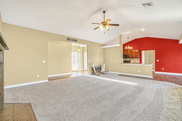 unfurnished living room featuring ceiling fan with notable chandelier, sink, carpet, and lofted ceiling