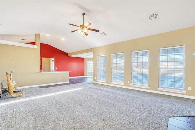 unfurnished living room with ceiling fan, carpet flooring, and lofted ceiling