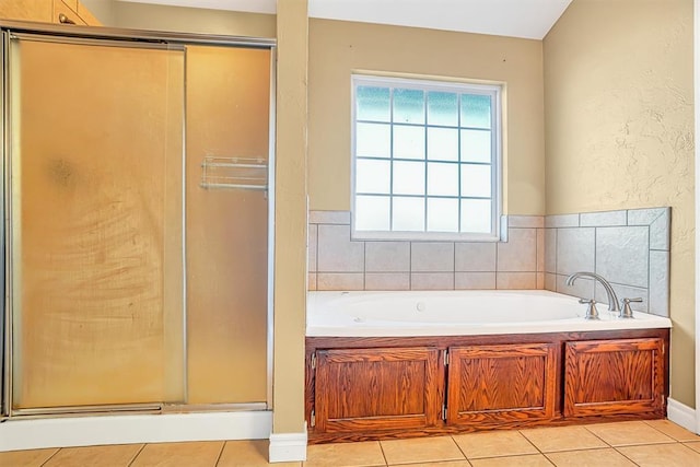 bathroom with tile patterned flooring and independent shower and bath