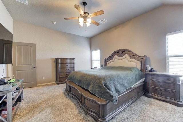 bedroom featuring ceiling fan, light carpet, and lofted ceiling