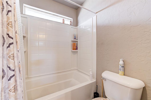 bathroom featuring shower / bathtub combination with curtain and toilet