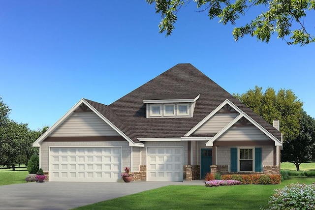 view of front of home with a garage and a front lawn