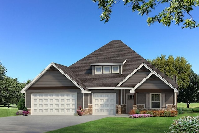 view of front of property featuring a front yard and a garage