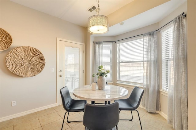 dining room with light tile patterned flooring