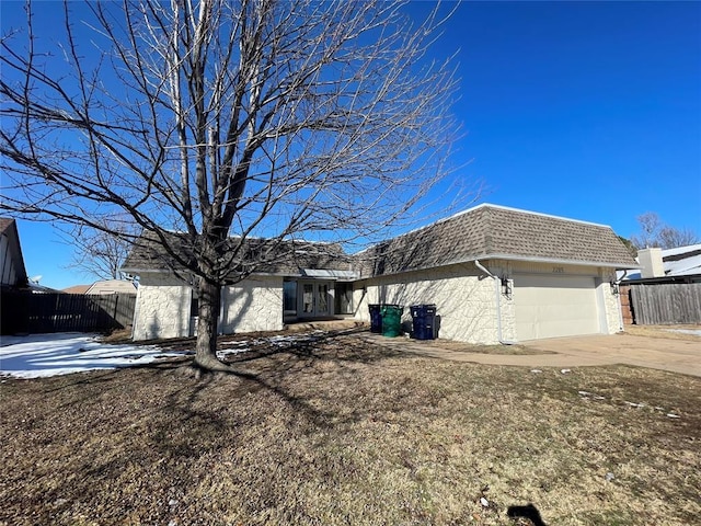 view of front of property with a garage