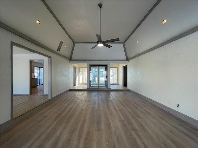 spare room with lofted ceiling, hardwood / wood-style floors, ornamental molding, and ceiling fan