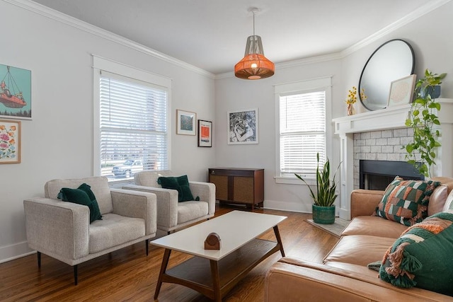 living room featuring a brick fireplace, hardwood / wood-style floors, and ornamental molding