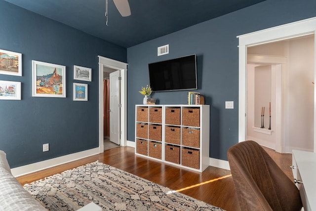 bedroom featuring ensuite bathroom, ceiling fan, and dark hardwood / wood-style floors