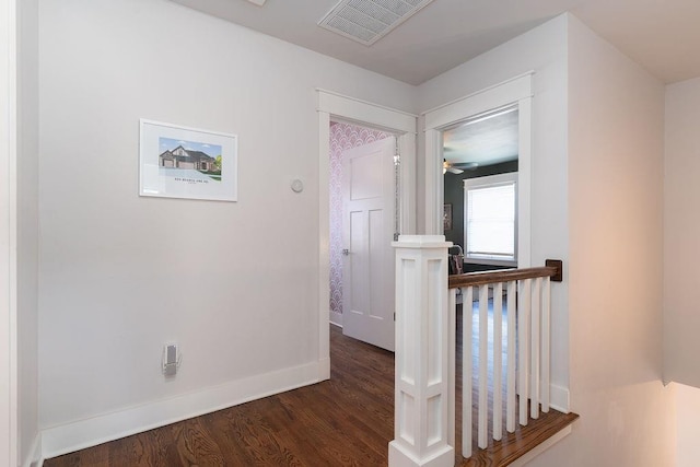 corridor with dark wood-type flooring