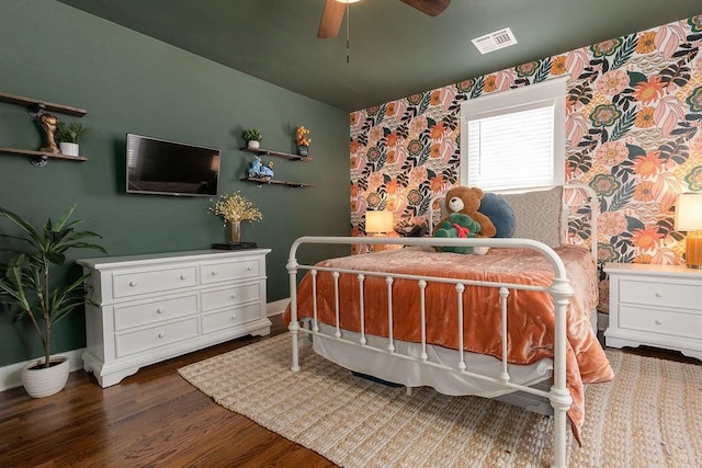 bedroom with ceiling fan and wood-type flooring