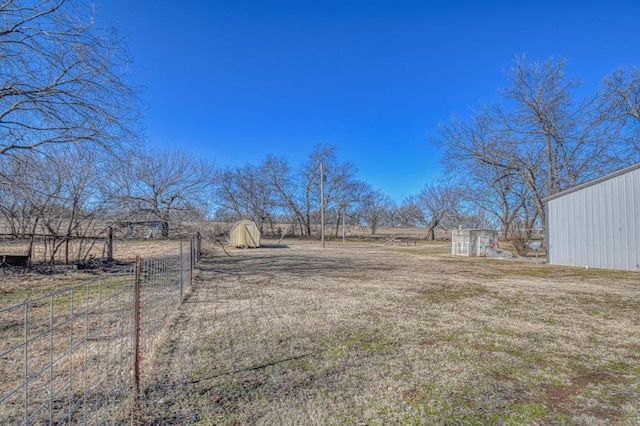 view of yard with a rural view