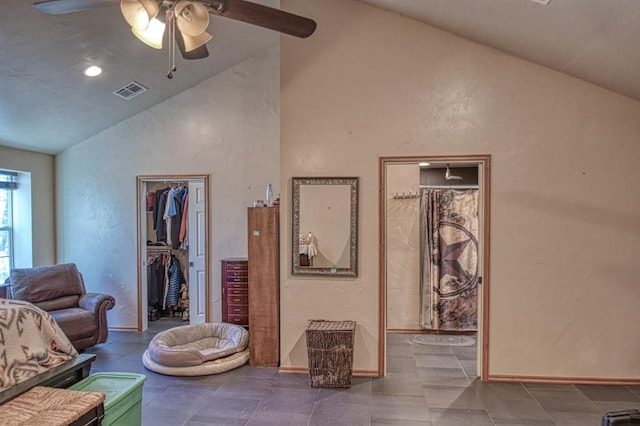 living room with lofted ceiling and ceiling fan