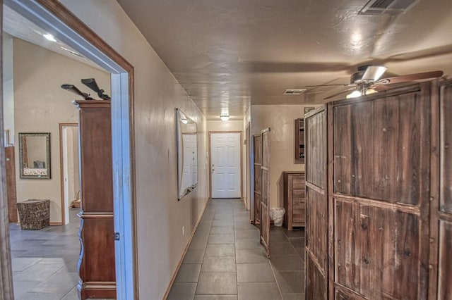 hallway featuring tile patterned floors