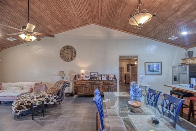 dining area with lofted ceiling, wood ceiling, crown molding, and ceiling fan