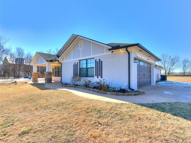 exterior space with a lawn and a garage