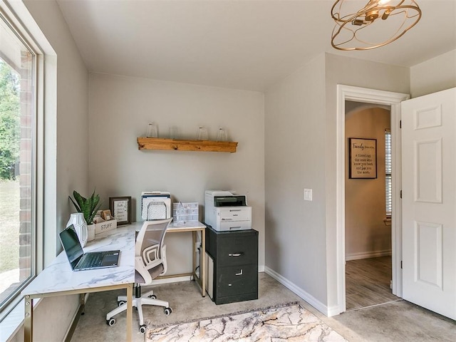 office featuring an inviting chandelier