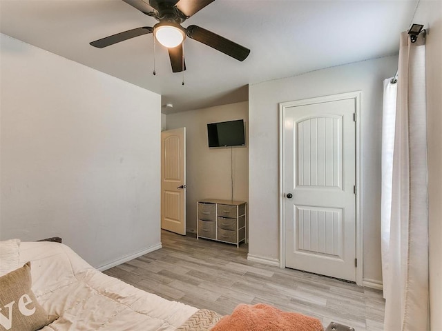 unfurnished bedroom featuring ceiling fan and light hardwood / wood-style flooring