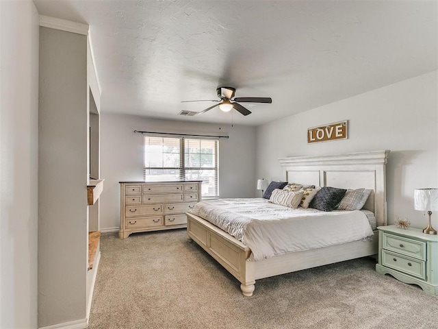 bedroom with ceiling fan and light colored carpet