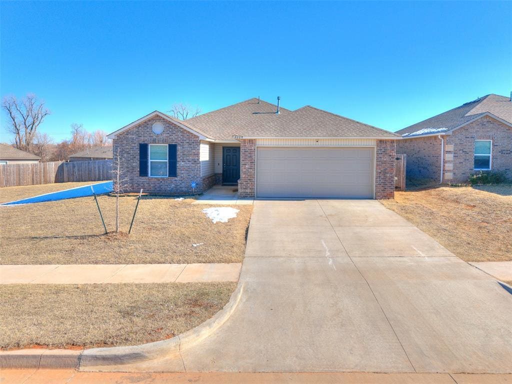 single story home with a garage