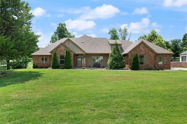 view of front of home with a front lawn