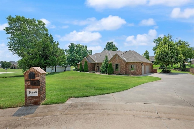 view of front facade with a garage and a front yard