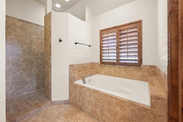 bathroom with tile patterned floors and plus walk in shower