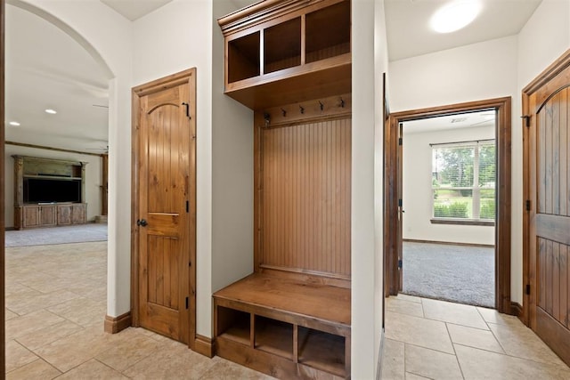 mudroom featuring light colored carpet