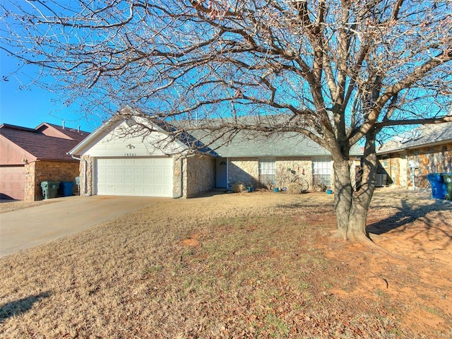 ranch-style house featuring a garage