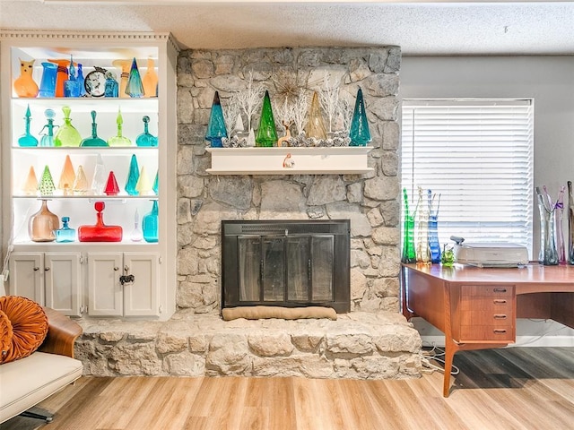 interior space featuring wood-type flooring and a fireplace