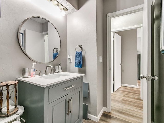 bathroom featuring vanity and wood-type flooring